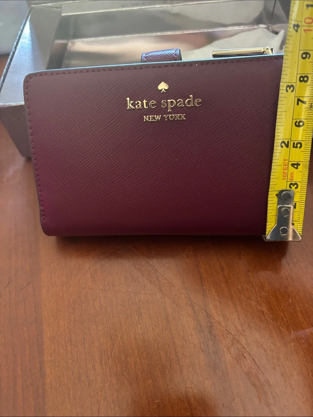 kate spade burgundy and gold zip-around wallet